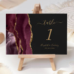 Burgundy Gold Agate Dark Wedding Table Number<br><div class="desc">The left-hand edge of this elegant modern wedding table number card features a burgundy watercolor agate border trimmed with faux gold glitter. The customizable text combines gold colored handwriting,  and italic and copperplate fonts on an off-black background.</div>