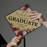 Burgundy Gold Pink Floral Graduation 2024 Graduation Cap Topper<br><div class="desc">Trendy graduation cap topper featuring a gold glitter background,  trendy burgundy and pink flowers,  the word "GRADUATE",  the students name,  school,  and class year.</div>