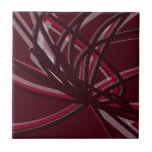 Burgundy & Gray Abstract Ribbons Ceramic Tile<br><div class="desc">Burgundy and gray tile features an artistic abstract ribbon composition with shades of burgundy wine maroon and gray with white accents on a burgundy wine colored background.</div>
