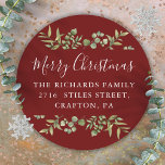 Burgundy Merry Christmas Greenery Return Address Classic Round Sticker<br><div class="desc">Watercolor greenery frames elegant script Merry Christmas typography on these elegant burgundy return address stickers. Personalize with your family name and address. Designed by Thisisnotme©</div>