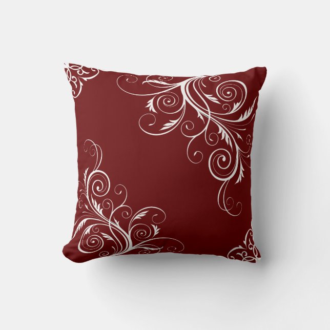 Burgundy pillow with cute patterns. (Front)