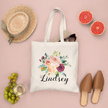Burgundy Pink Floral Bouquet Bridesmaid Name Tote Bag<br><div class="desc">Custom wedding tote bag features a stylish rustic monogram in script writing with a boho floral bouquet design with beautiful fall watercolor flowers, including roses, dahlias, peony flowers, and greenery, in a gorgeous autumn palette of burgundy red, golden yellow, peach orange, blush pink, and shades of green. Personalize with a...</div>