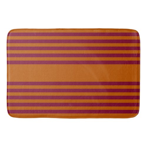 Burgundy red and burnt orange five stripe pattern bath mat