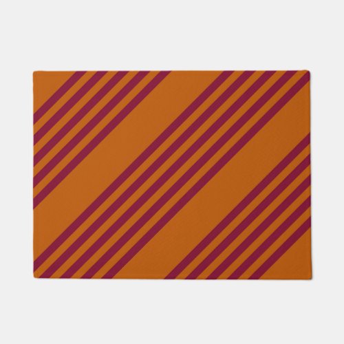 Burgundy red and burnt orange five stripe pattern doormat
