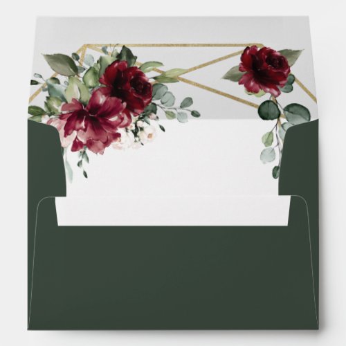 Burgundy Red Blush Gold Geometric Greenery Wedding Envelope - Design features a printed gold colored geometric frame with floral elements in shades of burgundy, red and blush over greenery, eucalyptus and flower blooms inside.  The flap features a matching floral bouquet.  Use a white or gold paint pen (found at most big box stores or craft outlets) to write out your guest names and addresses.