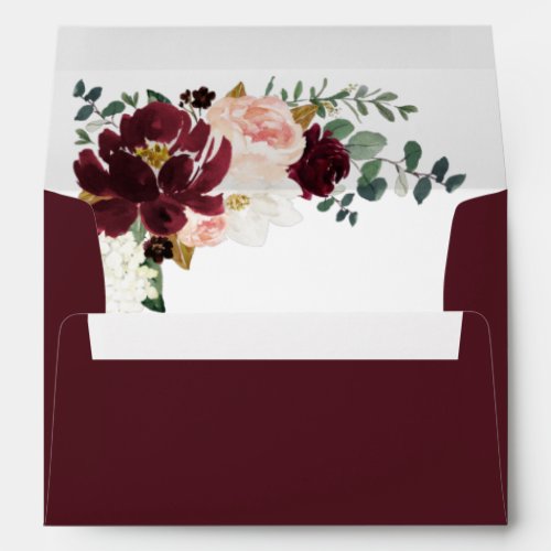 Burgundy Red Blush Pink and Gold Floral Wedding Envelope - Design (inside graphic) features peonies, magnolia, hydrangea, roses, Scottish thistle, and more in shades of burgundy, various types of red, blush pink white and navy blue (thistle). Design also features gold printed leaves and numerous types of green greenery including eucalyptus leaves or branches.  The outside is set to a burgundy shade that matches the floral elements inside.  You can change the exterior color on the product's retail page (if you know what color hex to use).