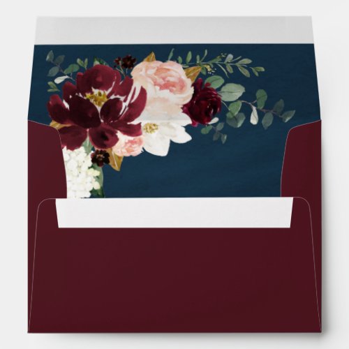Burgundy Red Blush Pink Gold and Navy Blue Wedding Envelope - Design (inside graphic) features peonies, magnolia, hydrangea, roses, Scottish thistle, and more in shades of burgundy, various types of red, blush pink white and navy blue (thistle). Design also features gold printed leaves and numerous types of green greenery including eucalyptus leaves or branches over a brushed watercolor printed background in navy blue.  The outside is set to a burgundy shade that matches the floral elements inside.  You can change the exterior color on the product's retail page (if you know what color hex to use).