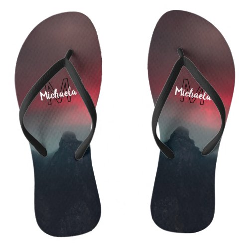 Burning clouds fog and mountains monogram in sky flip flops