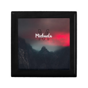 Burning clouds, fog and mountains monogram in sky gift box