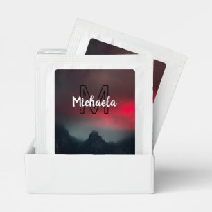 Burning clouds, fog and mountains monogram in sky tea bag drink mix
