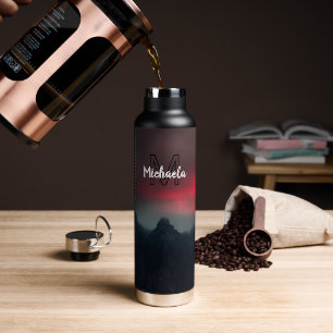 Burning clouds, fog and mountains monogram in sky water bottle