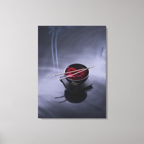 Burning incense on top of bowl of petals canvas print