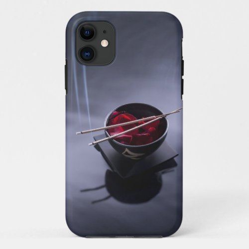 Burning incense on top of bowl of petals iPhone 11 case