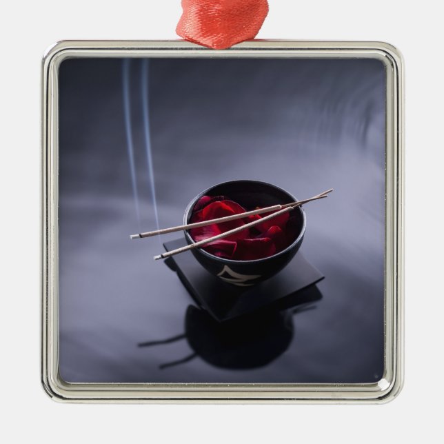 Burning incense on top of bowl of petals metal ornament (Front)
