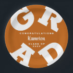 Burnt Orange and White Bold Text Graduation Paper Plates<br><div class="desc">GRAD in bold white lettering curves around the edges of these burnt orange graduation party paper plates - available in 2 sizes. Congratulations above the name of your graduate and the Class of below. The perfect addition to your table decor for upcoming grad parties. **TIP: Click on CUSTOMIZE button; click...</div>