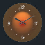 Burnt Orange/Brown Illuminated Design Wall Clock<br><div class="desc">An atmospheric clock with a brown border and illuminated burnt orange moon center.Complete with chic decay numerals.Different and original design by orientcourt zazzle. Also available in a square shape.</div>