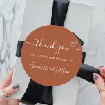 Burnt orange thank you heart wedding classic round sticker<br><div class="desc">A burnt orange,  dusty earth colored background.  With the text: Thank you for sharing our special day,  with a small heart.   Personalize and add your names.</div>