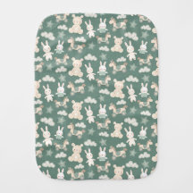 Burp cloth with baby toys on green