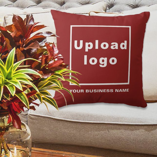 Business Name and Logo on Red Throw Pillow (Red throw pillow with your business name and logo displayed on sofa in a business lobby)