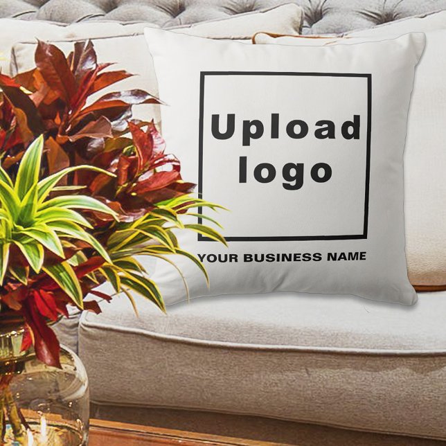 Business Name and Logo on White Throw Pillow (White throw pillow with your business name and logo displayed on sofa in a business lobby)