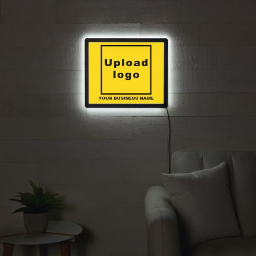 Business Name and Logo on Yellow Illuminated Sign