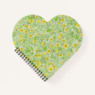 Buttercups on white notebook