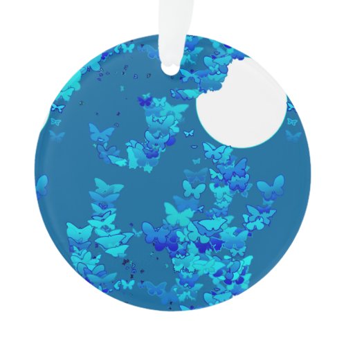 Butterflies against blue night sky, moonscape ornament