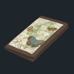 Butterflies on Sheet Music with Floral Design Trifold Wallet<br><div class="desc">A green floral design and sheet music serves as the background to a trio of butterflies in this piece by Vision Studio. The French word for butterfly, papillon, is emblazoned at the bottom of the piece as well. If you have a strong love of butterflies, nature, or just like surrounding...</div>