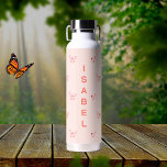 Butterflies peach rose gold name water bottle<br><div class="desc">Peach colored background decorated with pink and rose gold butterflies.  Personalize and add your name.  Peach colored letters.</div>