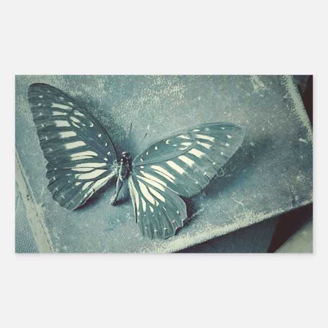 Butterfly on vintage books rectangular sticker (Front)