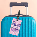 Butterfly pink purple flowers luggage tag<br><div class="desc">A girly pink background decorated with a purple butterfly,  pink and purple flowers,  pink confetti. Personalize and add your name and contact details.</div>