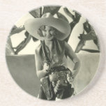 Cactus Kate Drink Coaster<br><div class="desc">Vintage photo of a cute young blond wearing very big cowboy hat, black and white cowhide chaps, holster and holding a gun</div>
