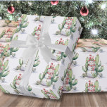 Cactus Snowman Christmas Wrapping Paper<br><div class="desc">Watercolor Cactus Snowman Christmas Wrapping Paper. This playful wrapping paper features a whimsical watercolor snowman surrounded by green cacti and succulents, all adorned with colorful holiday lights. It combines the charm of winter with the warmth of desert vibes, making it a fun and festive choice for your holiday gift wrapping....</div>