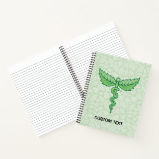 Caduceus with leaves background notebook
