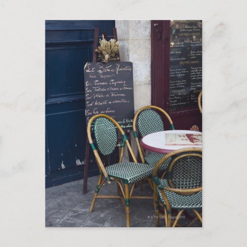 Cafe table with cane chairs in Paris France Postcard