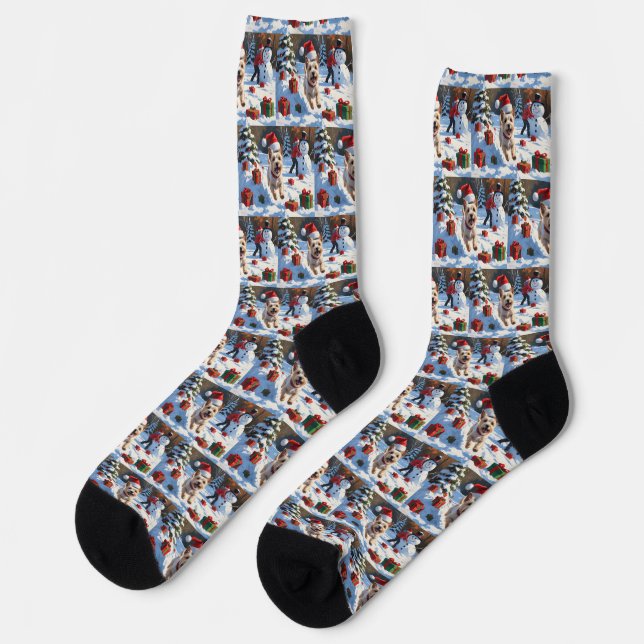 Cairn Terrier Running in Snow with Christmas Hat Socks (Left)