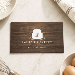 Cake Monogram Logo in White on Brown Woodgrain Business Card