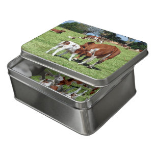 Calf suckling in field jigsaw puzzle