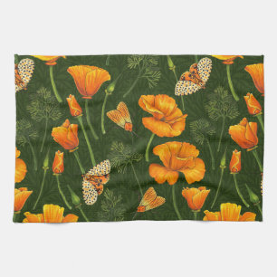 California poppies and moths on dark green kitchen towel