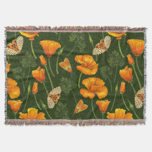 California poppies and moths on dark green throw blanket