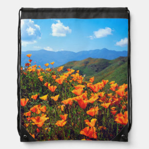 California poppies covering a hillside drawstring bag