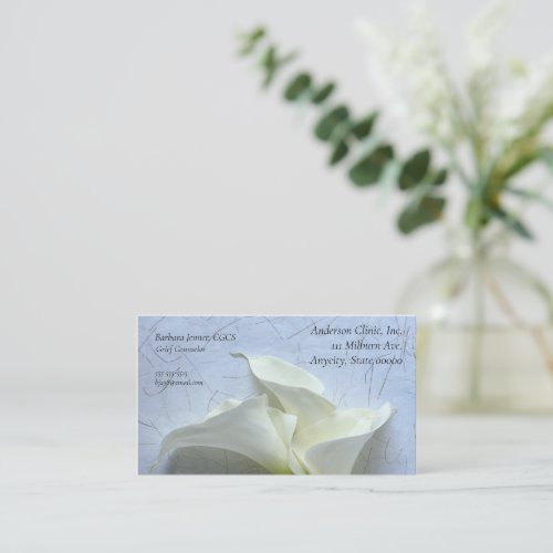 Calla lilies on decorative background business card