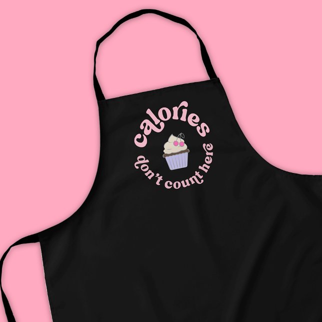 Calories Don't Count Here Pink Cake Baker Funny Apron (Modern black and pink baker & dessert enthusiast apron design with fun retro font and cupcake design)