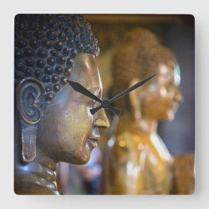 Cambodia, Phnom Penh. Buddha statues Square Wall Clock
