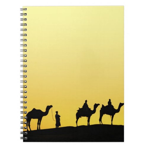 Camels and camel driver silhouetted at sunset 3 notebook