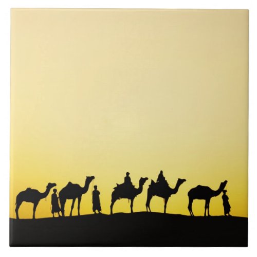 Camels and camel driver silhouetted at sunset 4 tile