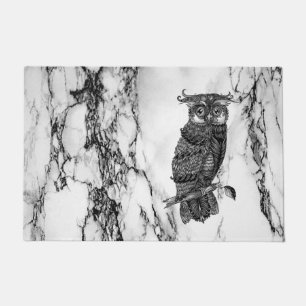 Camouflaged Owl on Marble Doormat