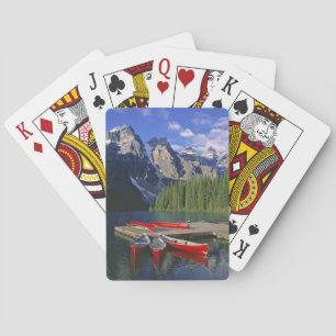 Canada, Alberta, Moraine Lake. Red canoes await Poker Cards