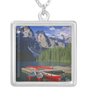 Canada, Alberta, Moraine Lake. Red canoes await Silver Plated Necklace