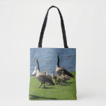 [ Thumbnail: Canada Geese On The Grass by The Water Tote Bag ]